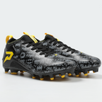Black and gray soccer cleat with yellow accents on a light gray background